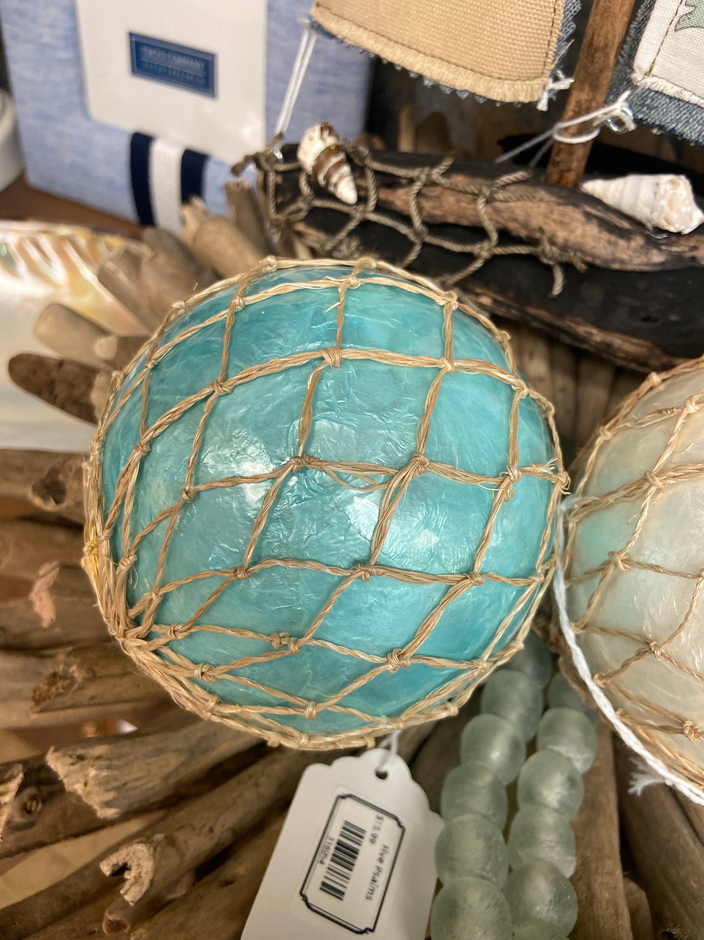 316054 Ball Aqua Capiz w Net 4" Round. (25)