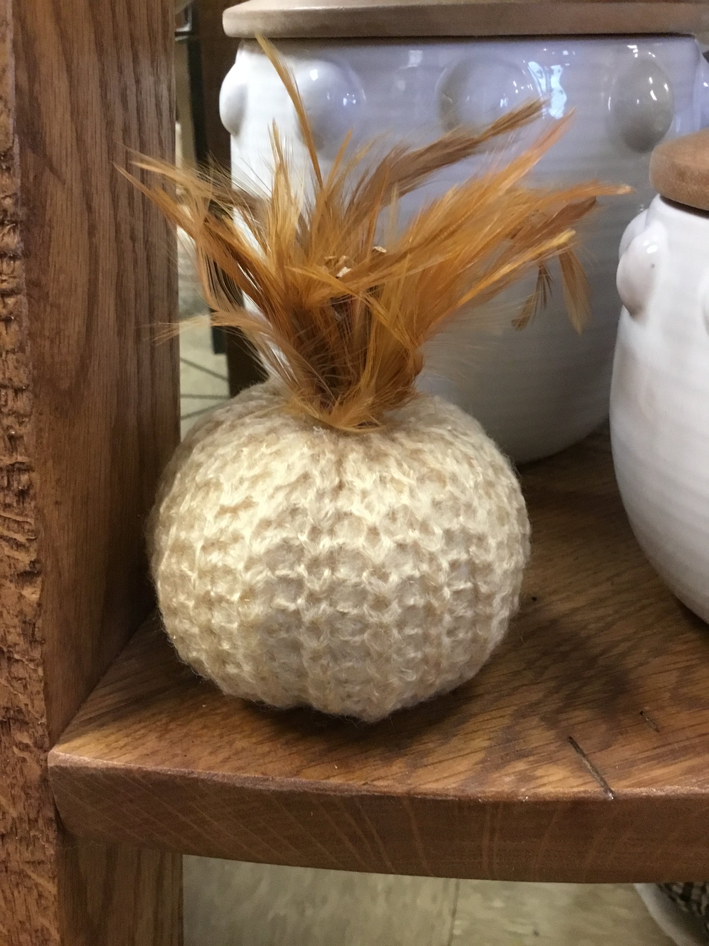 K&K Interiors 41246A-CR 4 Inch Cream Crochet Pumpkin with Wood Stem and Feathers