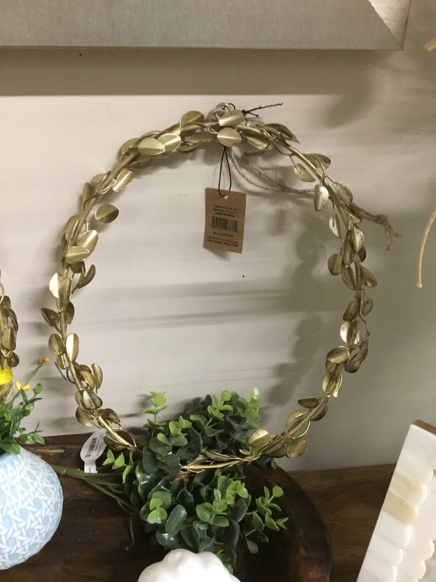 XM9467-CC 10.75x 13.25 Oval Metal Wreath W Brass Finish